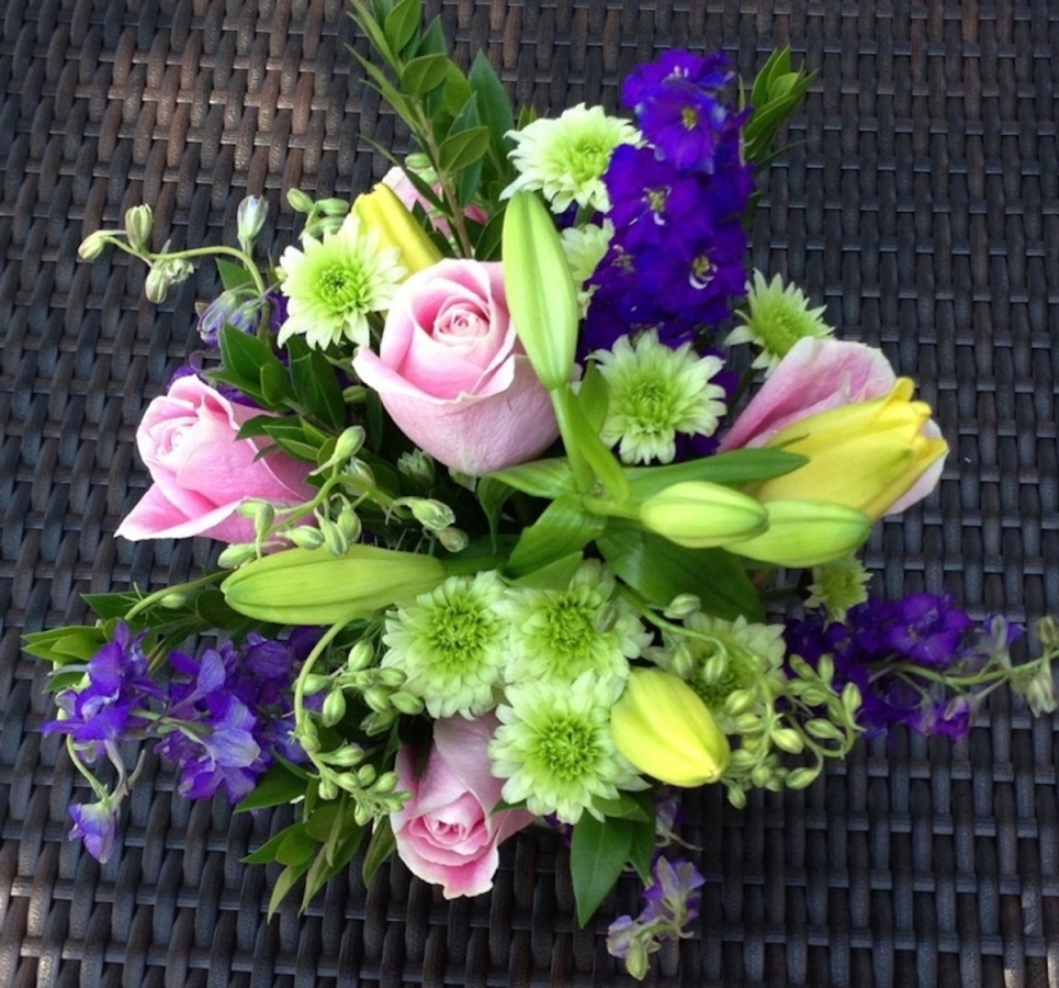 roses, lilies and larkspur